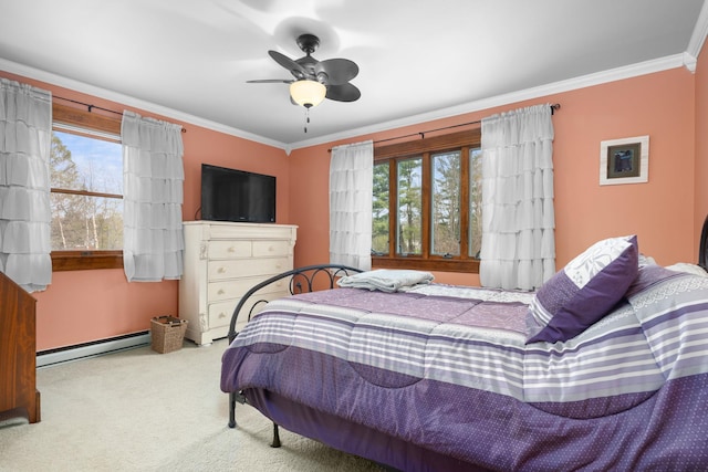 carpeted bedroom featuring ornamental molding, baseboard heating, and multiple windows