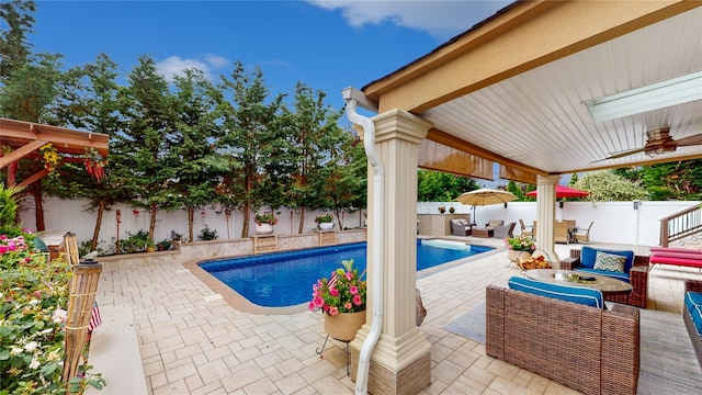 view of swimming pool with a fenced in pool, a fenced backyard, a patio, and an outdoor living space