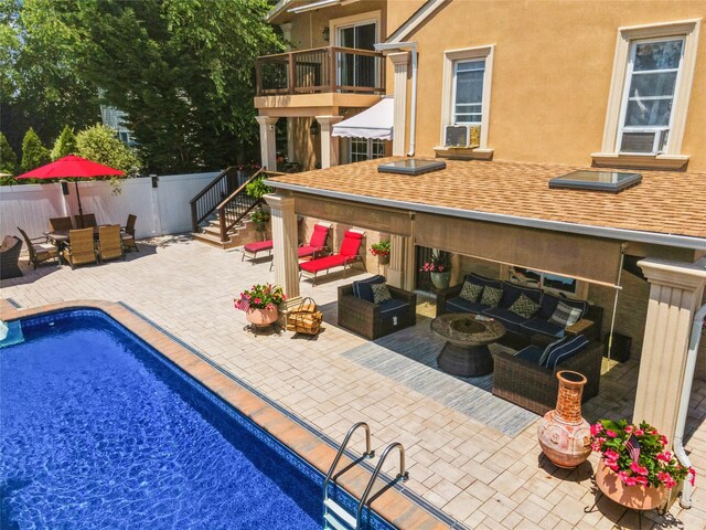 view of pool featuring outdoor lounge area, outdoor dining space, a patio area, fence, and cooling unit