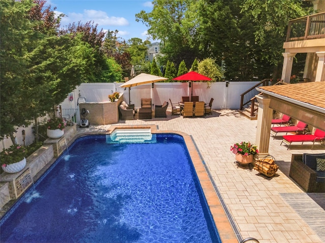 view of pool featuring a fenced in pool, a fenced backyard, an outdoor hangout area, outdoor dining area, and a patio area