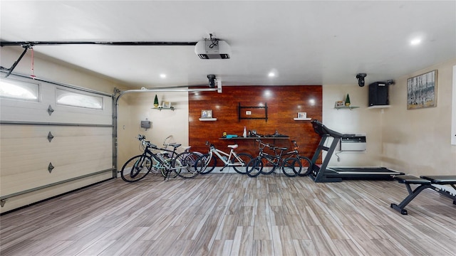 garage featuring a garage door opener and recessed lighting