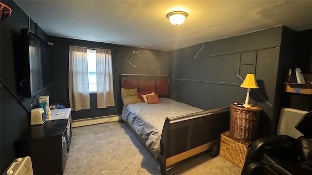 bedroom with a baseboard heating unit and carpet flooring