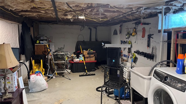 unfinished basement with washer / clothes dryer