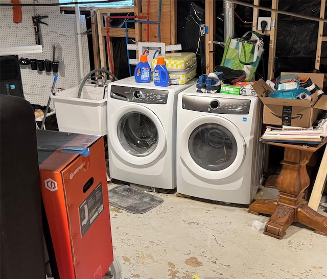 laundry room featuring a sink and washing machine and clothes dryer