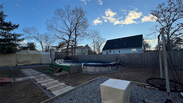 view of yard with a fenced in pool and a fenced backyard