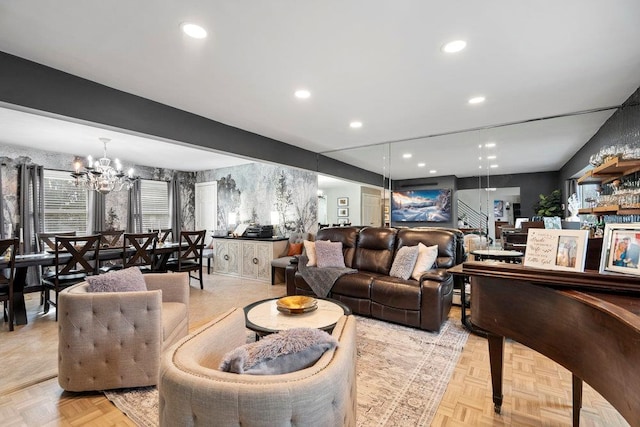 living room with stairs, recessed lighting, and a notable chandelier