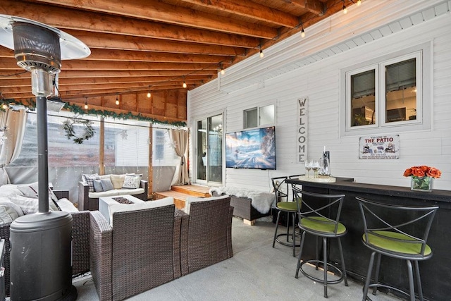 view of patio / terrace with an outdoor living space with a fire pit