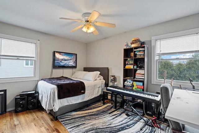 bedroom featuring a ceiling fan and wood finished floors