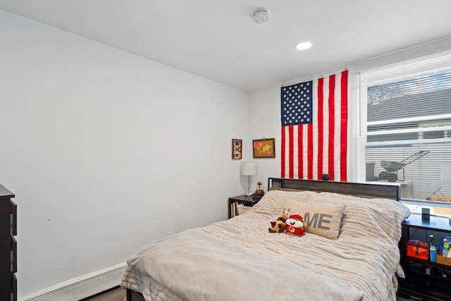 bedroom with a baseboard heating unit