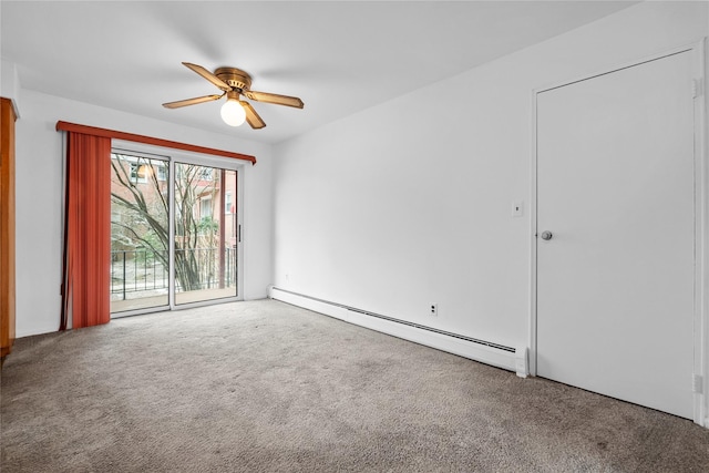 spare room featuring a baseboard heating unit, ceiling fan, and carpet