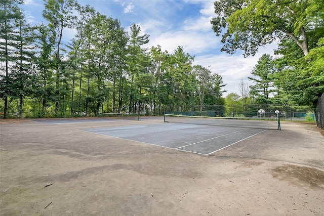 view of sport court with fence