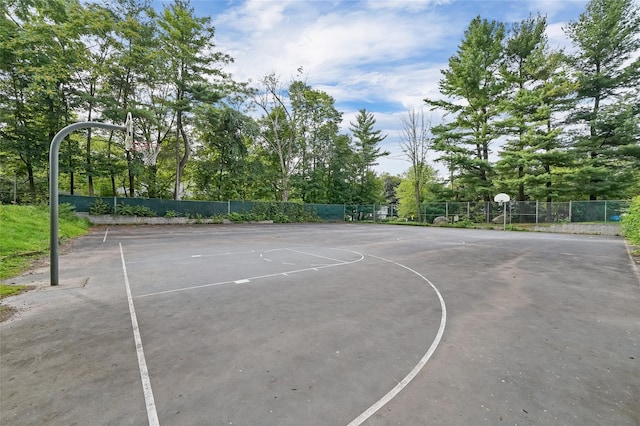 view of basketball court with community basketball court and fence