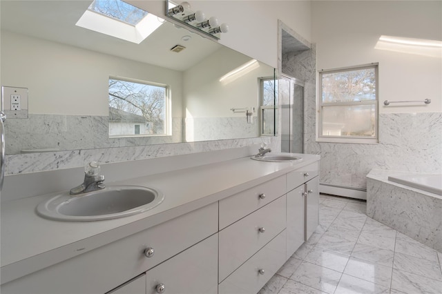 bathroom with double vanity, marble finish floor, a baseboard radiator, and a sink