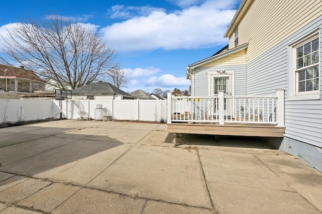 view of patio / terrace featuring fence and a wooden deck