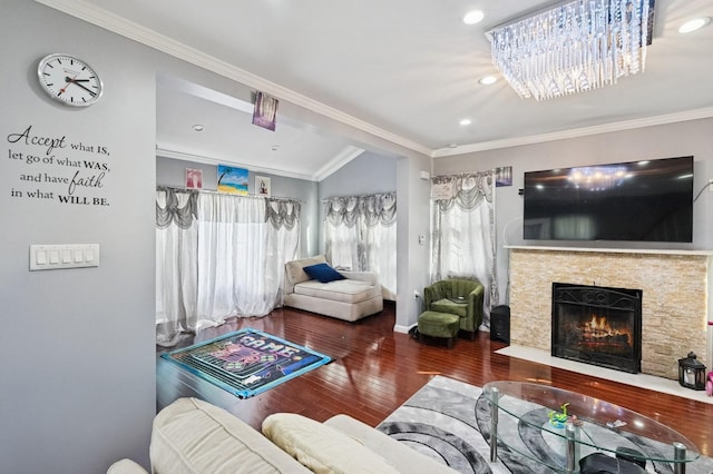 living area featuring recessed lighting, a fireplace, crown molding, and wood finished floors