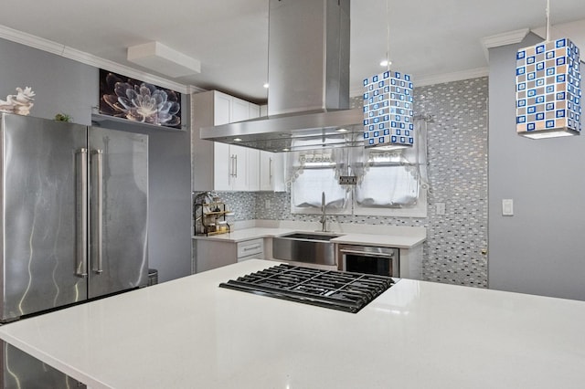 kitchen with island range hood, dishwasher, ornamental molding, white cabinetry, and high end fridge