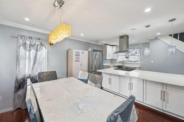 dining area featuring baseboards, ornamental molding, dark wood-type flooring, and recessed lighting