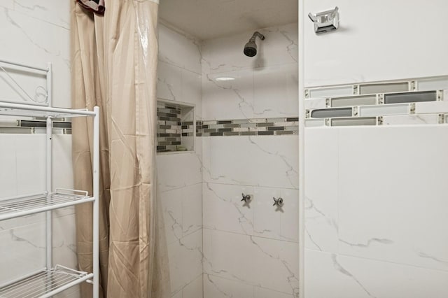 full bathroom with a tile shower