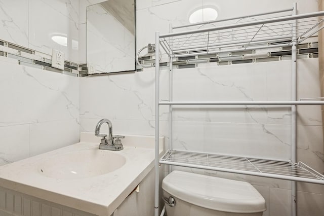 bathroom with toilet and vanity