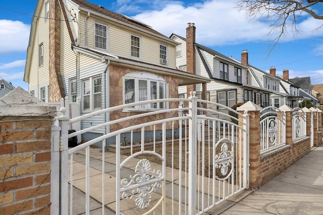 view of gate with fence