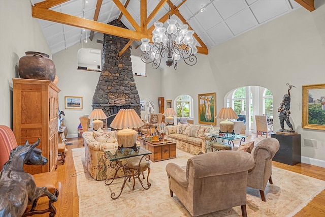 2 Aspen Pl, Great Neck, NY 11021 - living area with high vaulted ceiling, wood finished floors, a chandelier, beamed ceiling, and baseboards