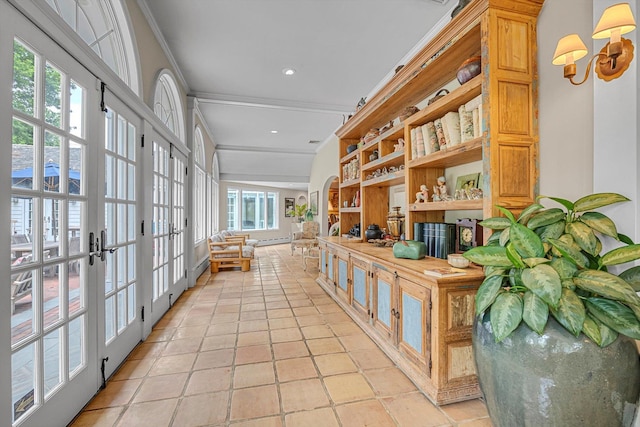 2 Aspen Pl, Great Neck, NY 11021 - corridor with french doors, crown molding, a baseboard radiator, and light tile patterned floors