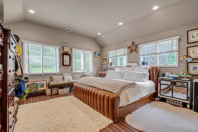 2 Aspen Pl, Great Neck, NY 11021 - bedroom with vaulted ceiling, wood finished floors, multiple windows, and recessed lighting