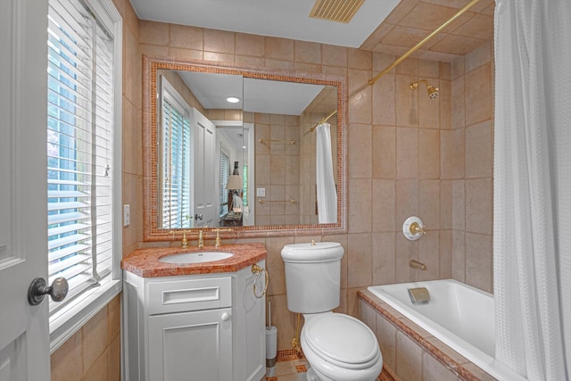2 Aspen Pl, Great Neck, NY 11021 - full bath featuring tile walls, tiled shower / bath combo, vanity, and toilet