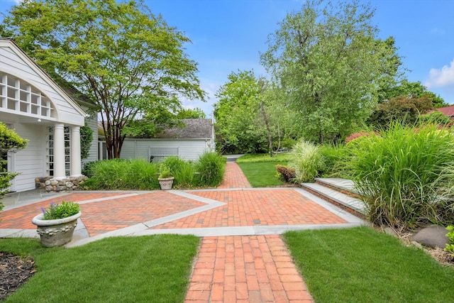 2 Aspen Pl, Great Neck, NY 11021 - view of grassy yard with a patio area