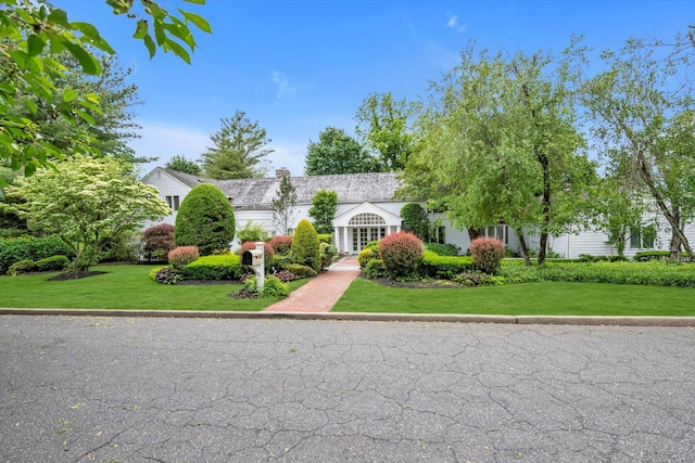 2 Aspen Pl, Great Neck, NY 11021 - view of property hidden behind natural elements featuring a front yard