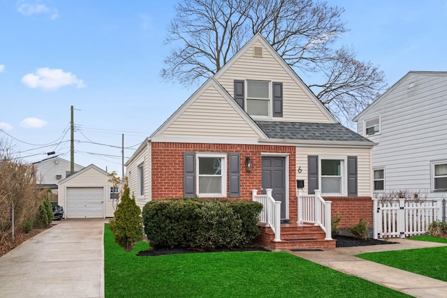 bungalow with brick siding, an outdoor structure, fence, a detached garage, and concrete driveway