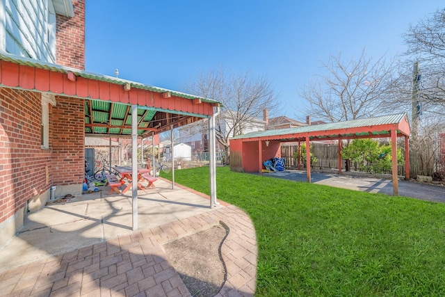 view of yard with a fenced backyard and a patio