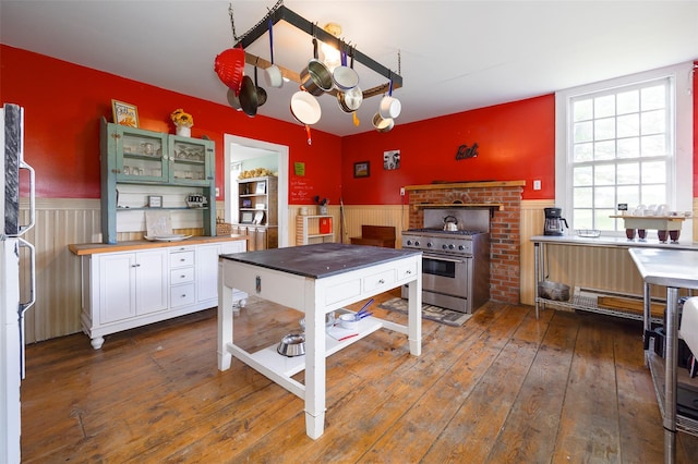 148 N Creek Rd, Staatsburg, NY 12580 - kitchen featuring high end stainless steel range, wainscoting, hardwood / wood-style flooring, white cabinetry, and wood counters