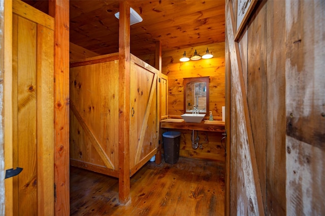 148 N Creek Rd, Staatsburg, NY 12580 - corridor with wooden ceiling, wood-type flooring, wooden walls, and a sink