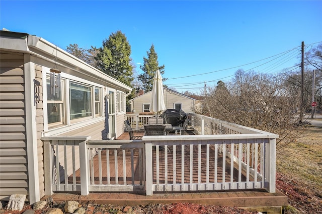 wooden terrace with area for grilling