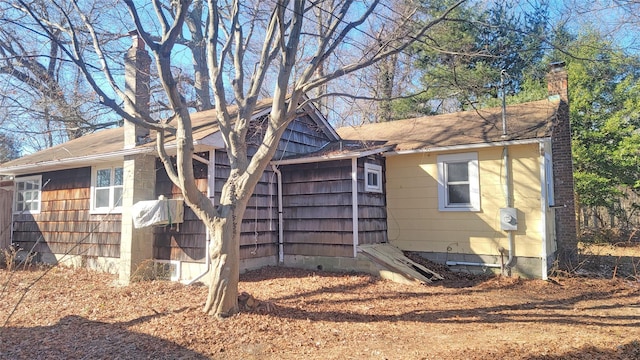 view of home's exterior featuring a chimney