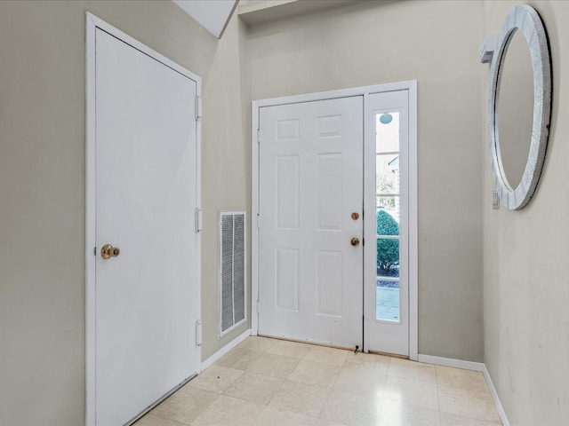 entryway featuring baseboards and visible vents