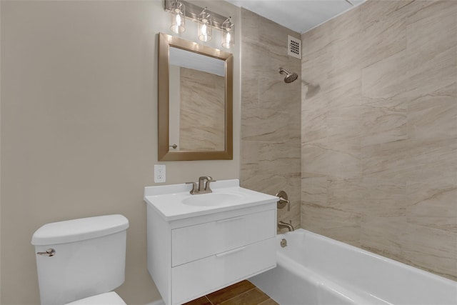 bathroom with shower / washtub combination, visible vents, vanity, and toilet