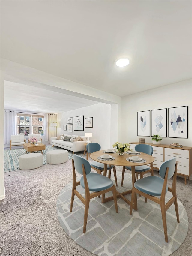 dining area featuring light carpet