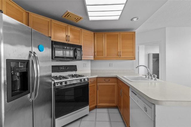 kitchen featuring black microwave, visible vents, stainless steel fridge with ice dispenser, dishwasher, and range with gas cooktop