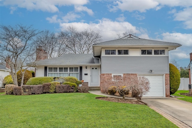 split level home with a front yard, brick siding, driveway, and an attached garage