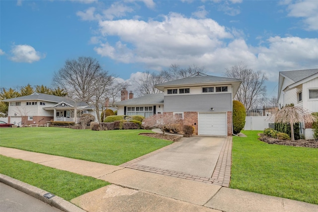 view of front of property with driveway, a chimney, fence, a front lawn, and brick siding