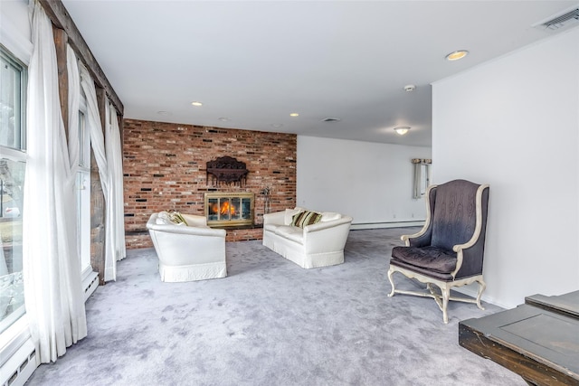 living area featuring a fireplace, visible vents, baseboard heating, and carpet flooring