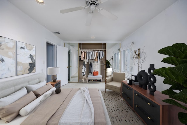 bedroom featuring a ceiling fan, visible vents, a closet, and carpet flooring