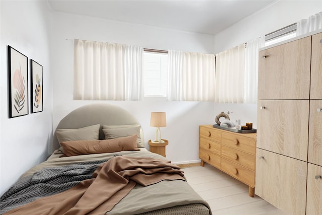 bedroom featuring light wood-style floors