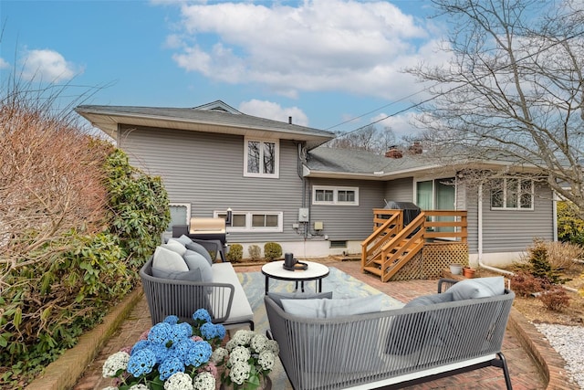 rear view of house featuring outdoor lounge area and a patio