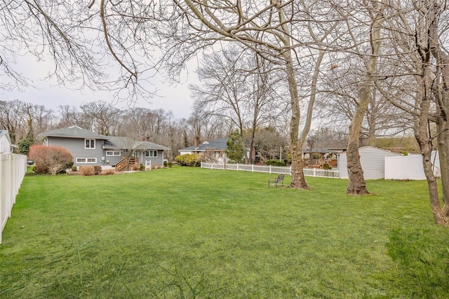 view of yard featuring a fenced backyard