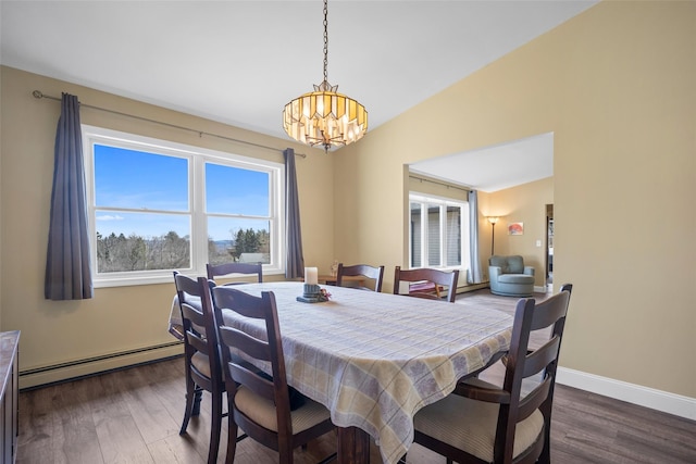 dining area with a chandelier, baseboard heating, dark wood-type flooring, and baseboards