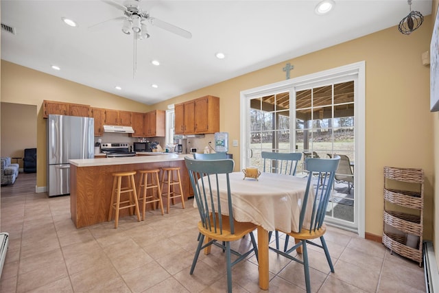 dining area with visible vents, recessed lighting, a baseboard radiator, and vaulted ceiling