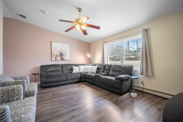 living area with vaulted ceiling, wood finished floors, visible vents, and a baseboard radiator